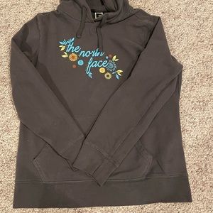 A grey, women’s North Face hoodie. It is in good shape and is an XL.